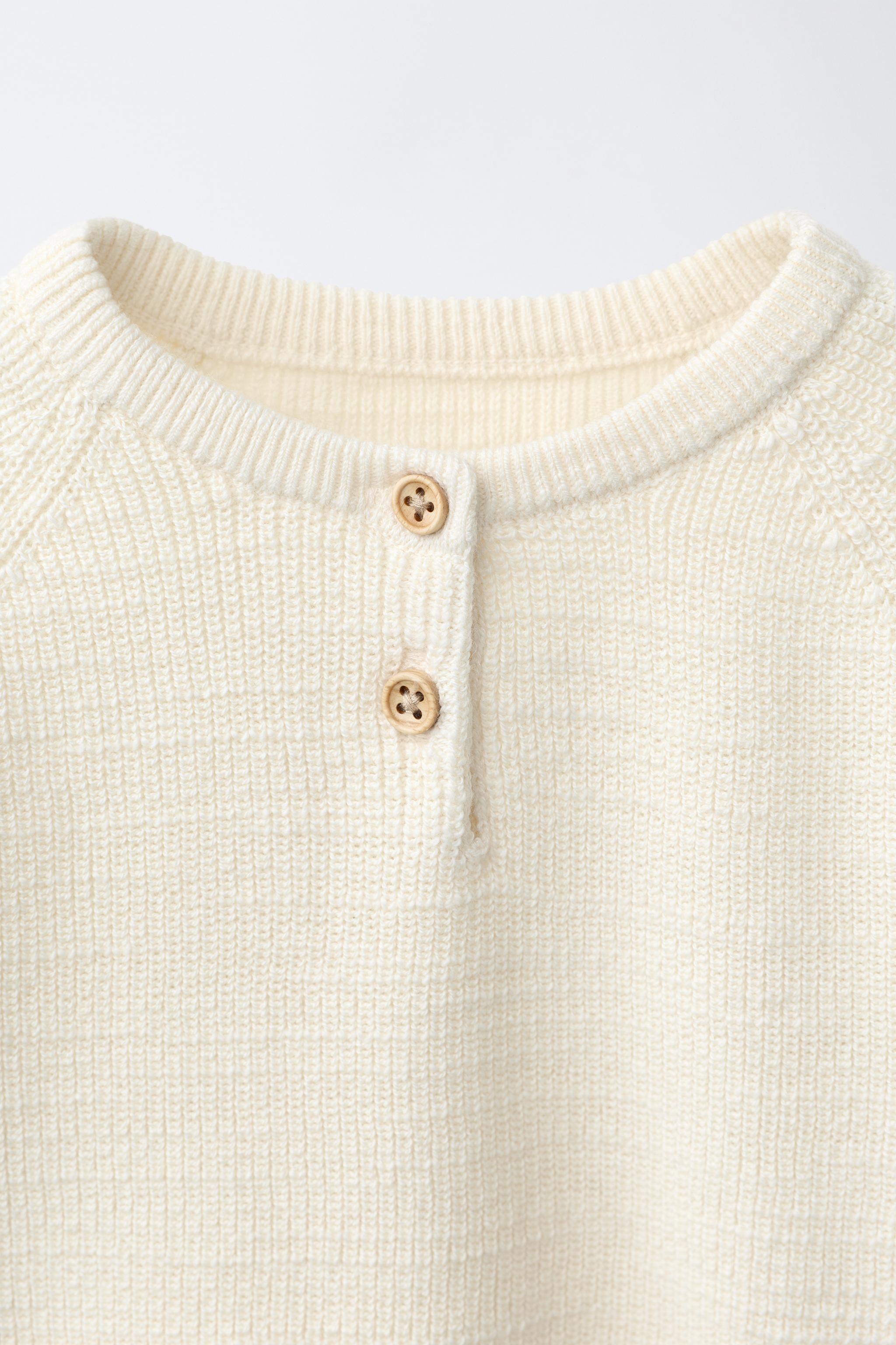PULL EN MAILLE PERLÉE AVEC ÉTIQUETTE